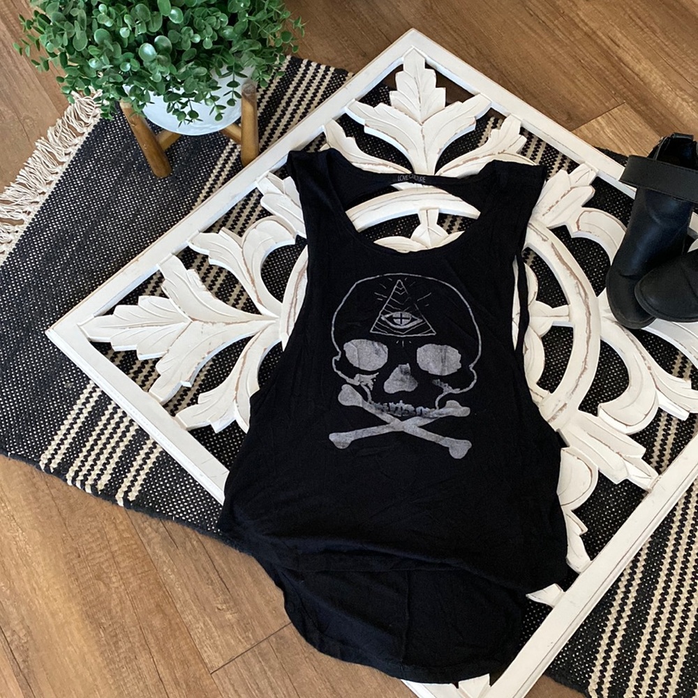 Black tank top with open back and skull design. Size medium.